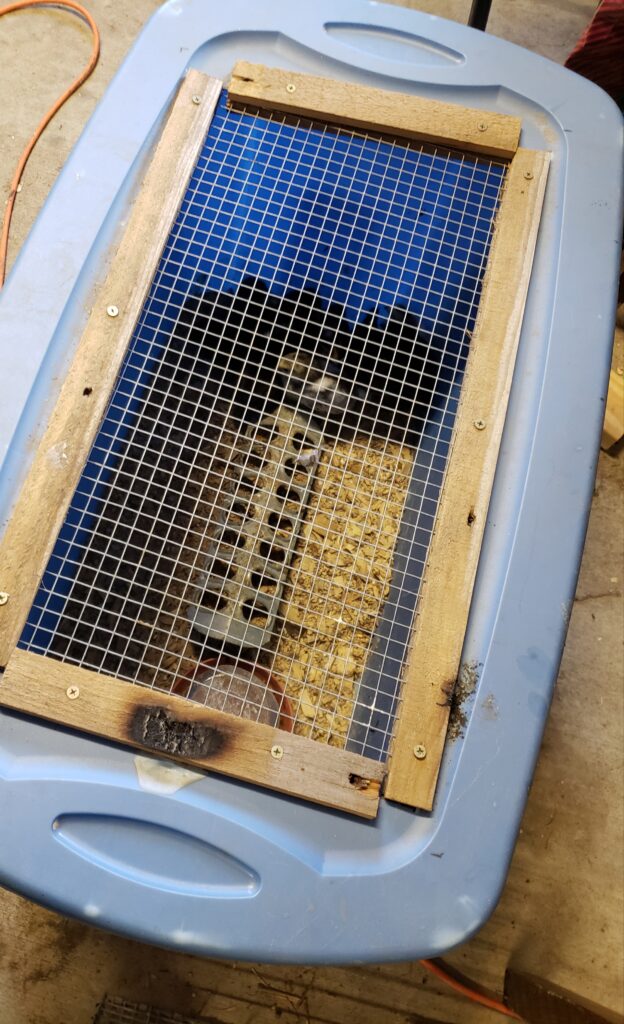 Homemade brooder box- ignore the burn marks!